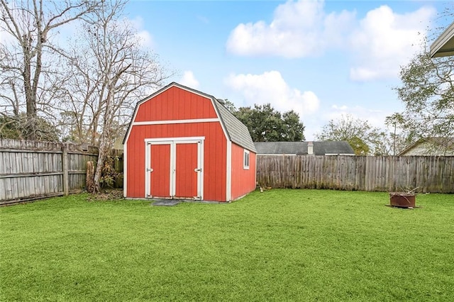 view of outdoor structure with a lawn