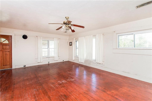 unfurnished room with hardwood / wood-style floors and ceiling fan