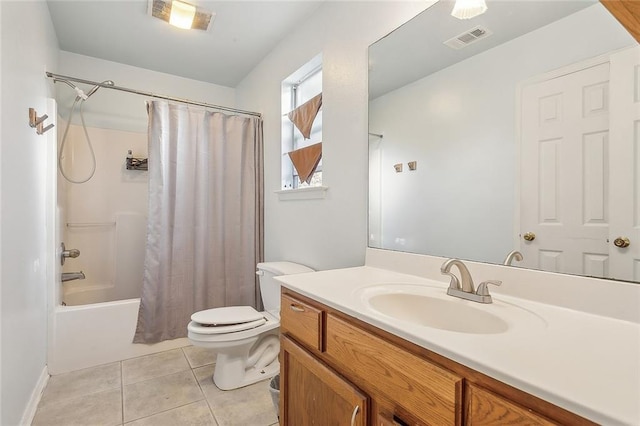 full bathroom featuring tile patterned flooring, vanity, toilet, and shower / tub combo