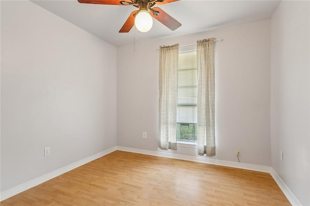 empty room with ceiling fan and light hardwood / wood-style floors