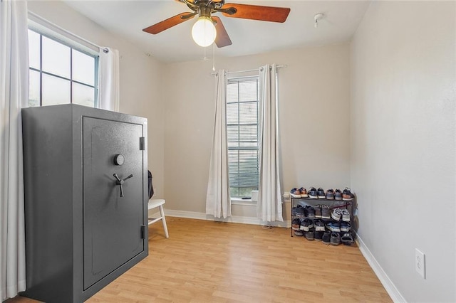 miscellaneous room with ceiling fan and light wood-type flooring