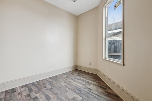 spare room featuring hardwood / wood-style floors