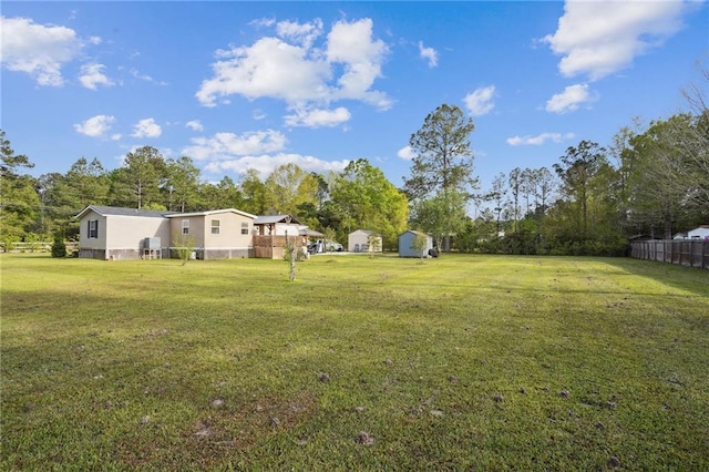 view of yard featuring a storage unit