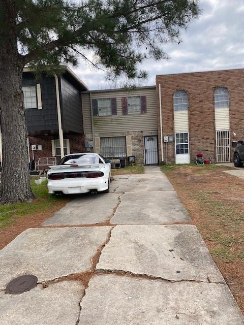 7112 Barrington Ct, New Orleans, LA 70128 - townhome / multi-family property featuring brick siding