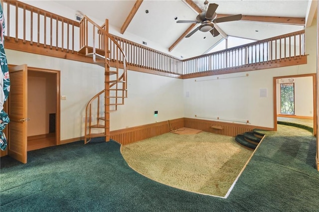 carpeted living room with beam ceiling, plenty of natural light, high vaulted ceiling, and ceiling fan