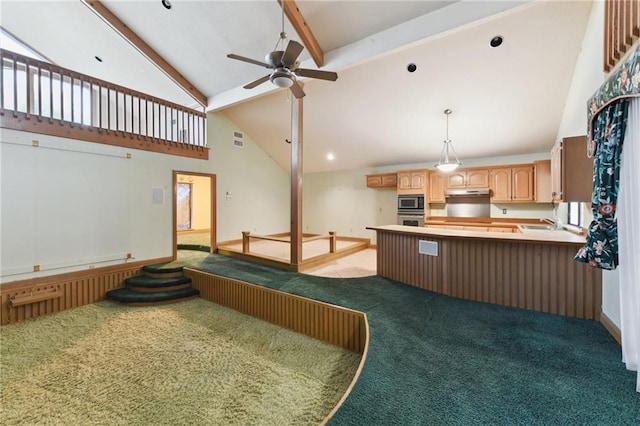 kitchen featuring beam ceiling, high vaulted ceiling, stainless steel appliances, carpet floors, and light brown cabinets