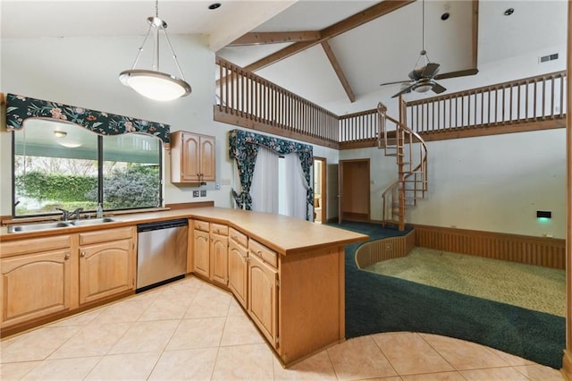 kitchen featuring sink, ceiling fan, hanging light fixtures, stainless steel dishwasher, and kitchen peninsula