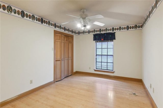 spare room featuring hardwood / wood-style flooring and ceiling fan