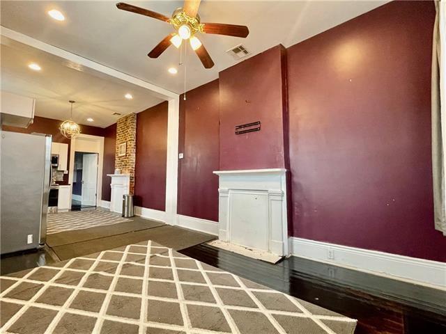 interior space with stainless steel refrigerator and ceiling fan