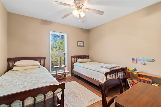 bedroom featuring ceiling fan and wood-type flooring