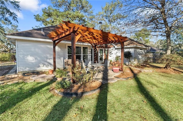 rear view of property with a pergola, a lawn, and a patio