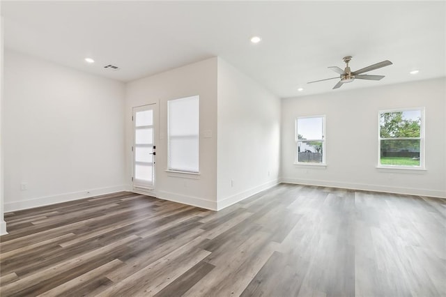 interior space featuring ceiling fan and dark wood-type flooring