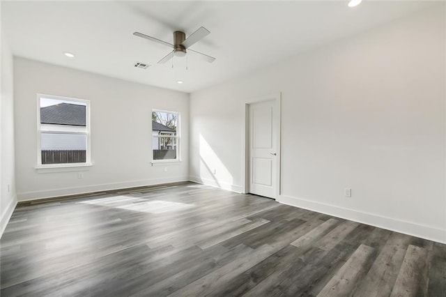 unfurnished room with dark wood-type flooring and ceiling fan