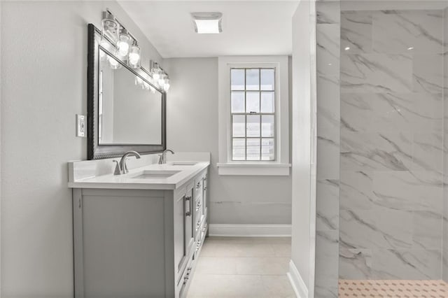 bathroom featuring vanity and a tile shower