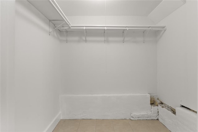 spacious closet featuring light tile patterned floors