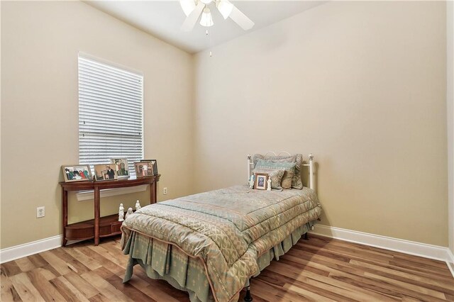 bedroom with ceiling fan and light hardwood / wood-style flooring