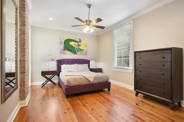 bedroom featuring ornamental molding, ceiling fan, and light hardwood / wood-style floors