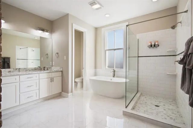 full bathroom with shower with separate bathtub, vanity, and toilet