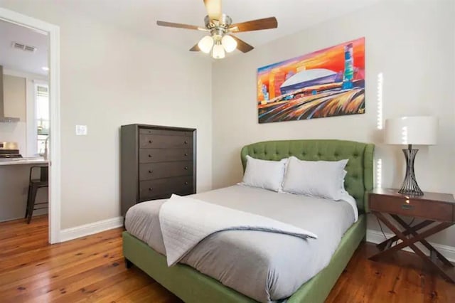 bedroom featuring ceiling fan and wood-type flooring