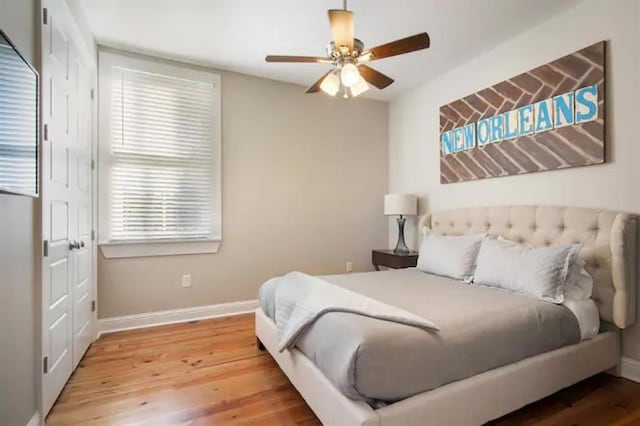 bedroom featuring wood-type flooring and ceiling fan