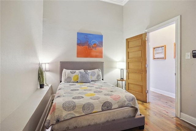 bedroom featuring hardwood / wood-style floors