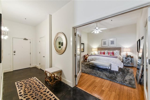 bedroom with dark wood-type flooring and ceiling fan