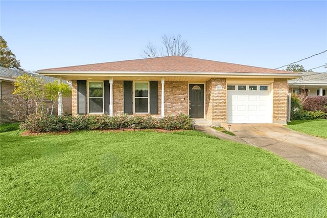 ranch-style home featuring a garage and a front lawn