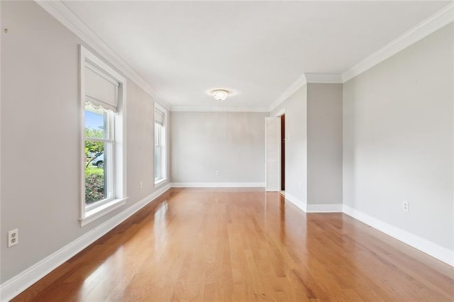 unfurnished room with ornamental molding and light hardwood / wood-style flooring