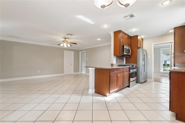 kitchen with ceiling fan with notable chandelier, stainless steel appliances, light tile patterned flooring, and ornamental molding