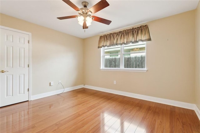 unfurnished room with ceiling fan and hardwood / wood-style flooring