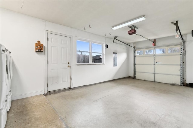 garage with white refrigerator, electric panel, and a garage door opener