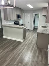 kitchen featuring range, dark wood-type flooring, and sink