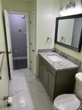 bathroom with vanity and toilet