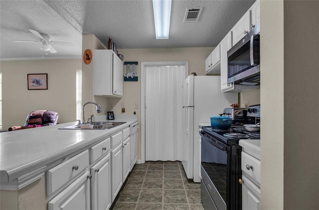 kitchen with sink, white cabinetry, black electric range oven, and a textured ceiling