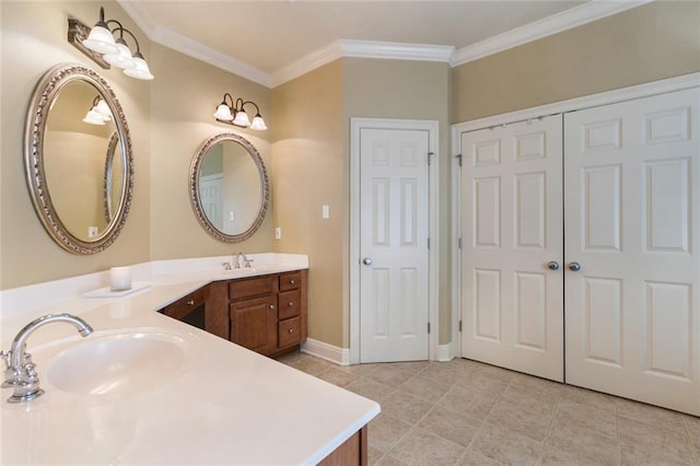 bathroom featuring vanity, tile patterned flooring, and crown molding