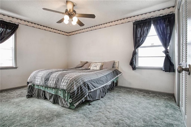 carpeted bedroom with ceiling fan