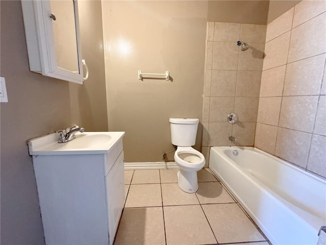 full bathroom with vanity, tile patterned floors, tiled shower / bath combo, and toilet