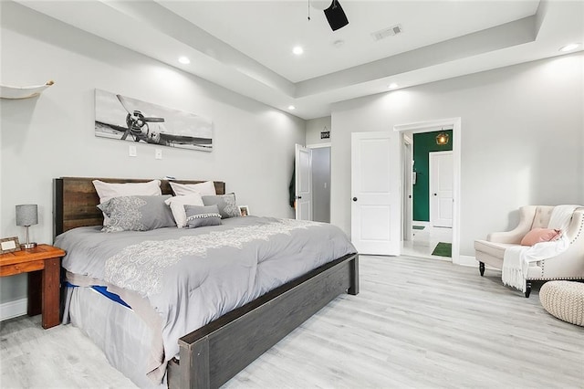 bedroom featuring ceiling fan and light hardwood / wood-style flooring