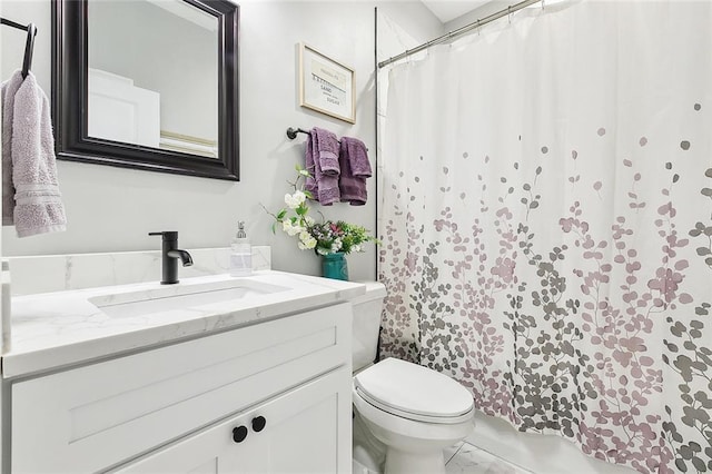 bathroom with toilet and vanity