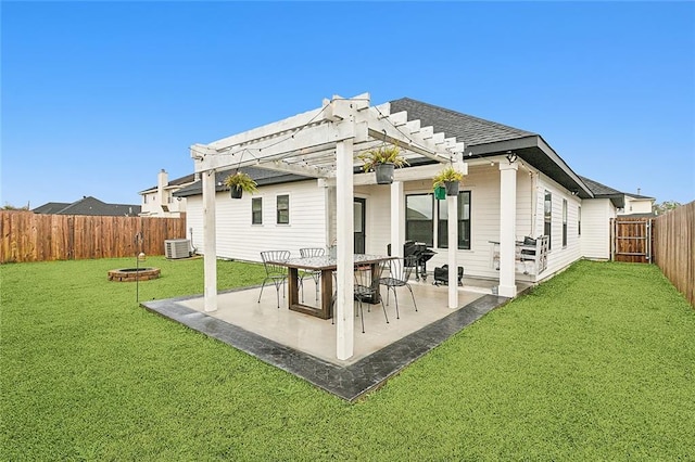 rear view of property with a pergola, a yard, a patio, and central AC unit