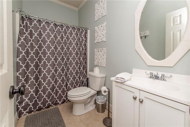 bathroom with vanity, toilet, ornamental molding, and tile patterned flooring