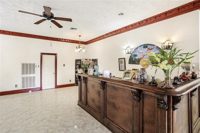 reception area featuring ceiling fan with notable chandelier