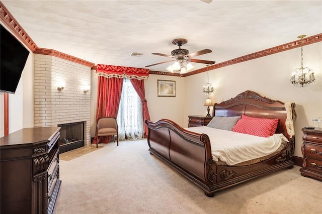 carpeted bedroom featuring a brick fireplace, crown molding, and ceiling fan with notable chandelier