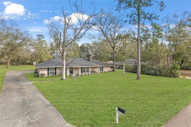 single story home with a front yard