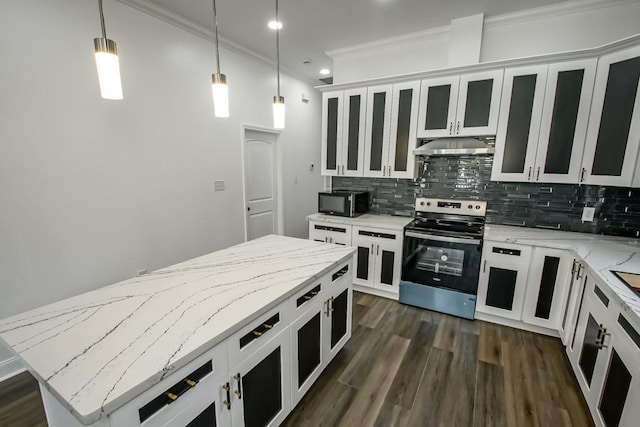 kitchen with hanging light fixtures, a center island, tasteful backsplash, white cabinets, and stainless steel electric range oven