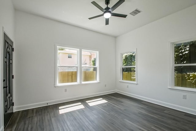 unfurnished room featuring ceiling fan and dark hardwood / wood-style floors