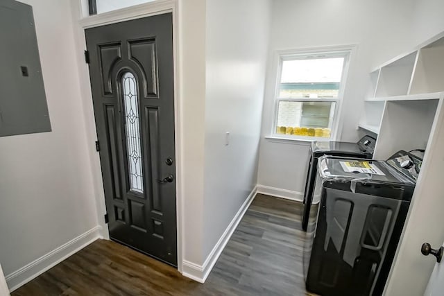 entryway with dark hardwood / wood-style flooring, electric panel, and independent washer and dryer