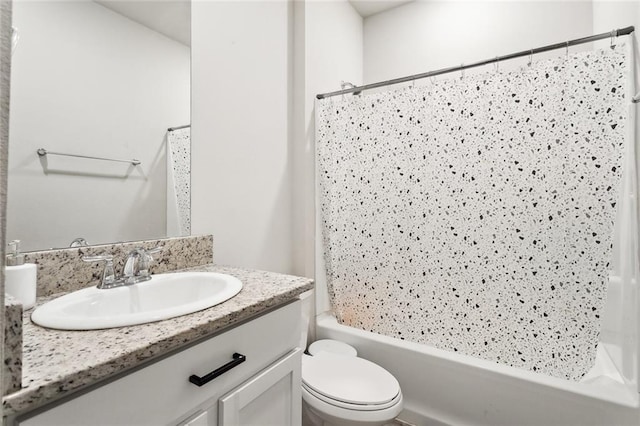 full bathroom featuring shower / tub combination, vanity, and toilet