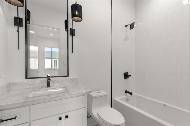 full bathroom with vanity, toilet, and tiled shower / bath combo