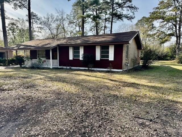 exterior space with a yard and a porch